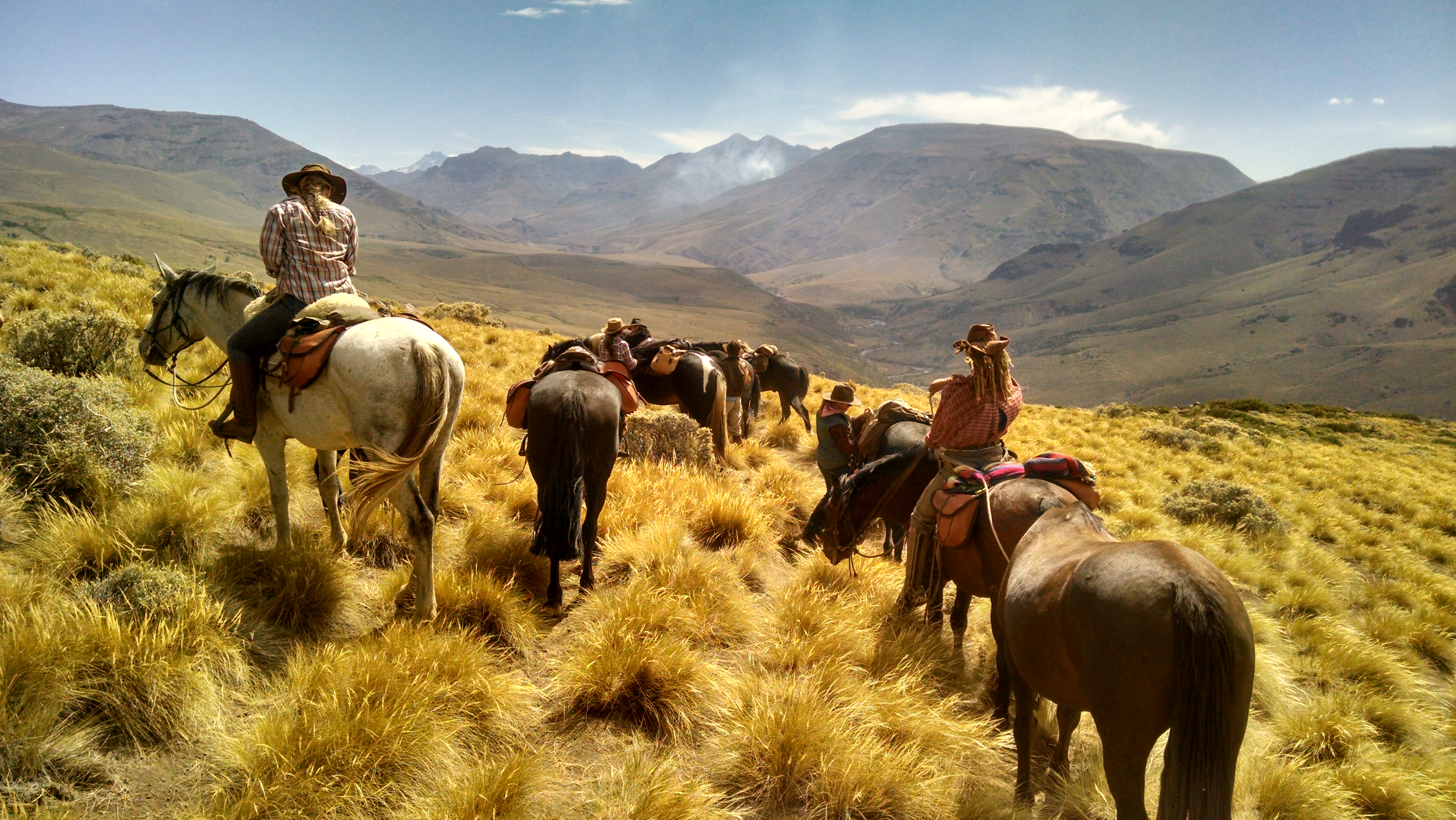 Women riding horses through Patagonia Argentina