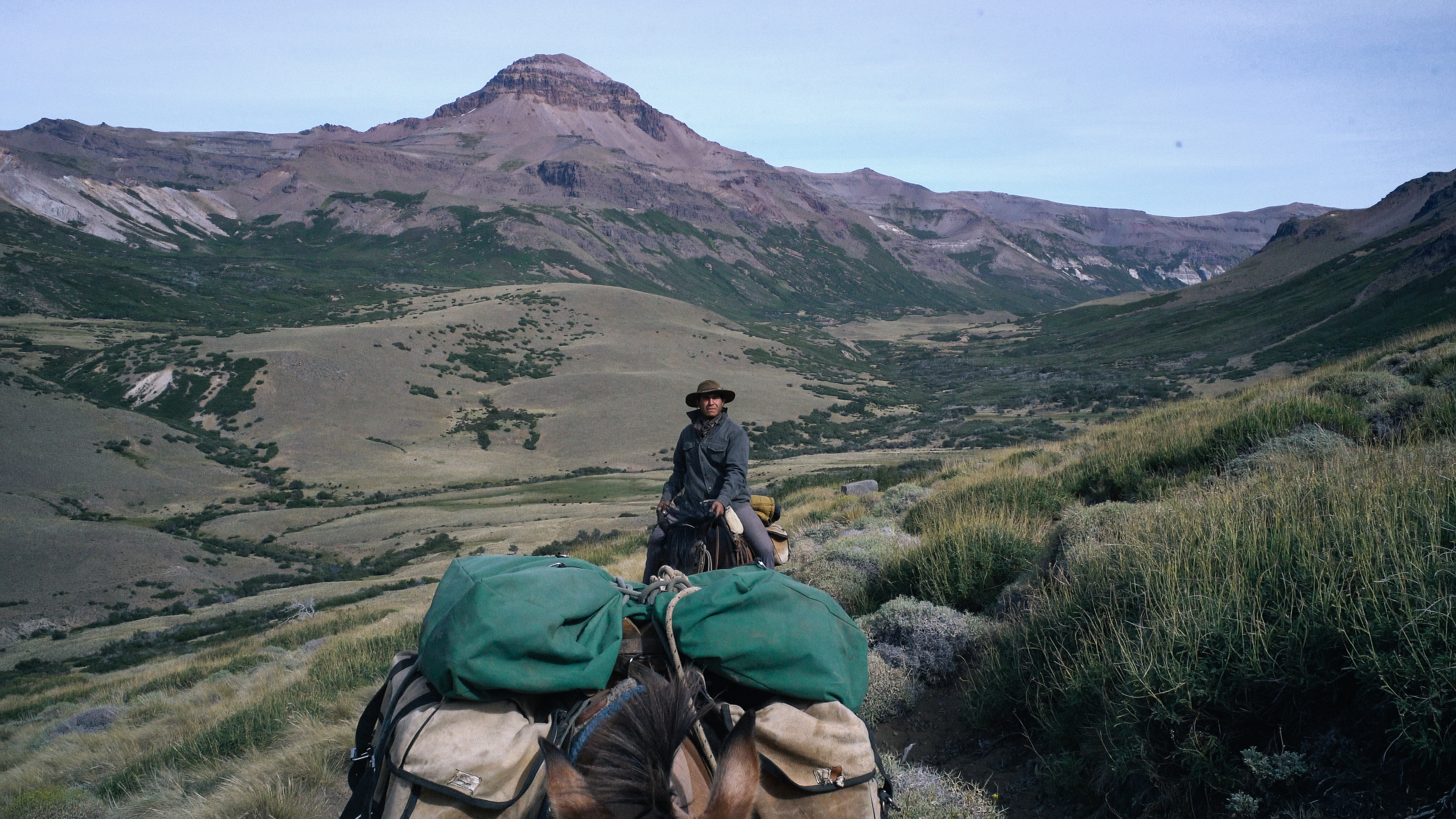 Man riding in the Andes with a pack mule on an Estancia Ranquilco pack trip