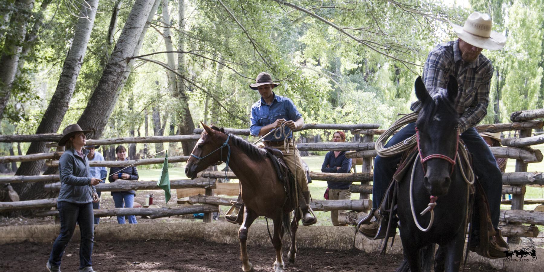 Reata and Gabe Clark in the round corral teaching a natural horsemanship clinic at Estancia Ranquilco